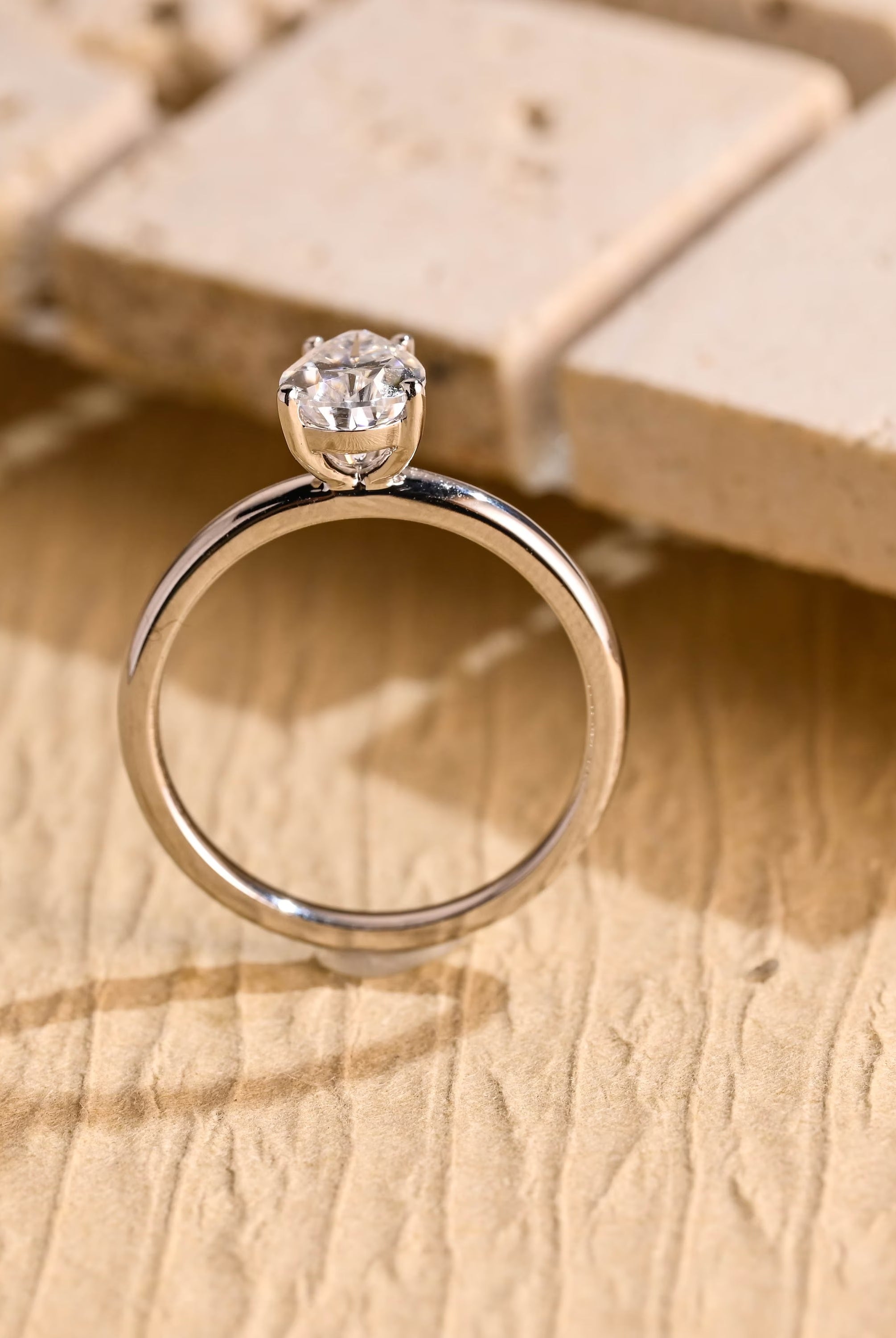 sparkling pear cut solitaire moissanite ring