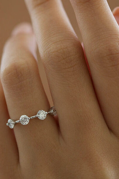 round-cut-four-stone-setting-moissanite-engagement-ring