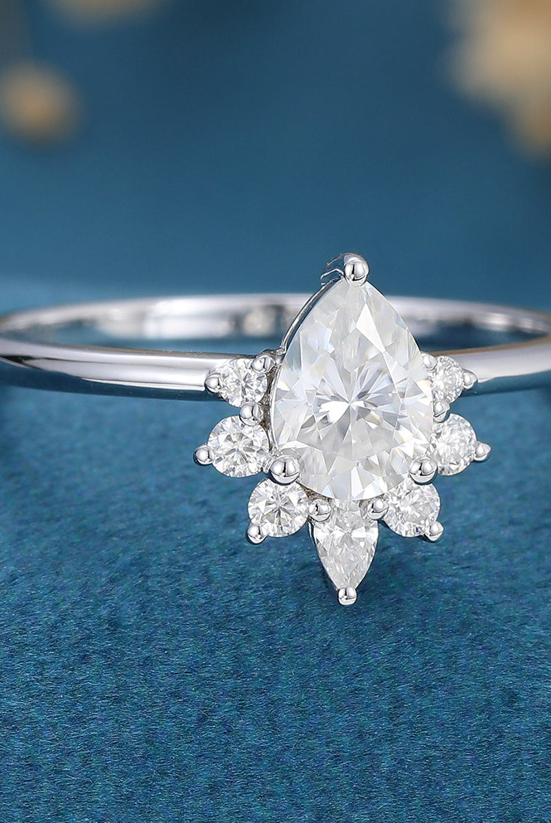 0-69-ct-pear-shaped-moissanite-cluster-engagement-ring-4