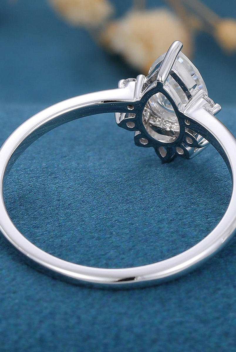 0-69-ct-pear-shaped-moissanite-cluster-engagement-ring-6