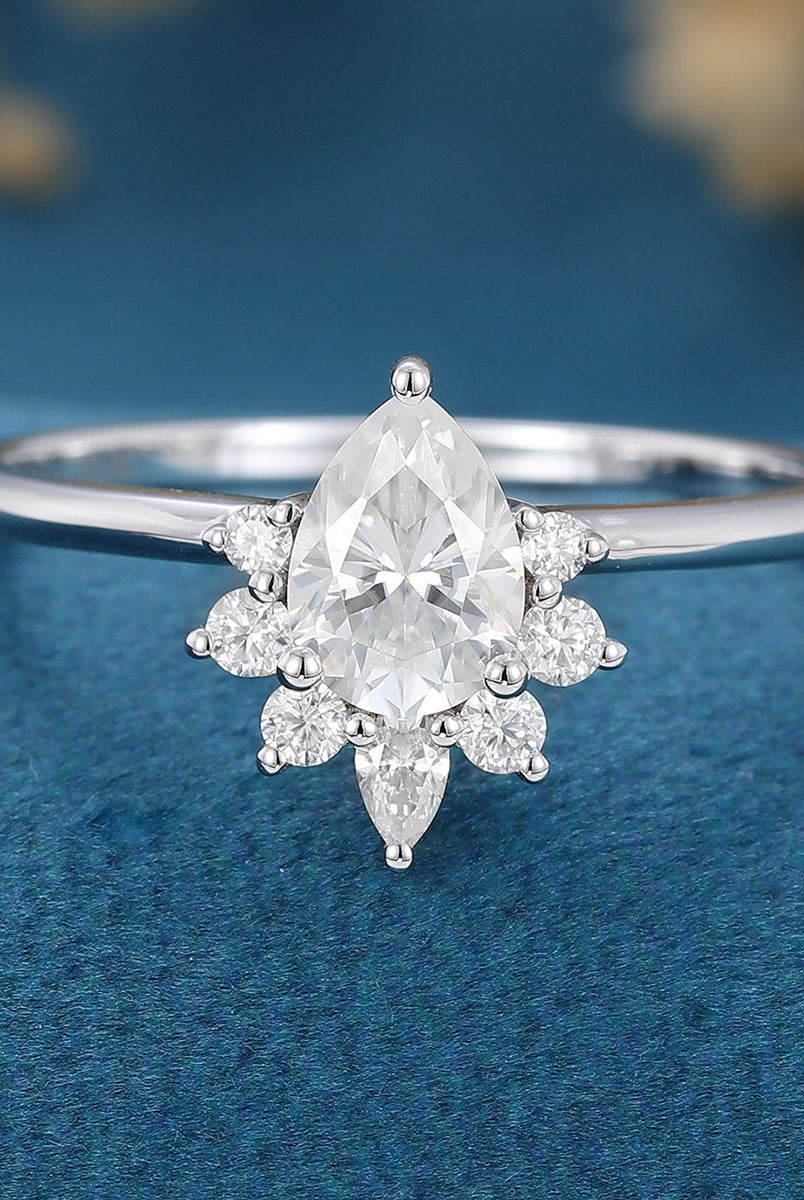 0-69-ct-pear-shaped-moissanite-cluster-engagement-ring-2