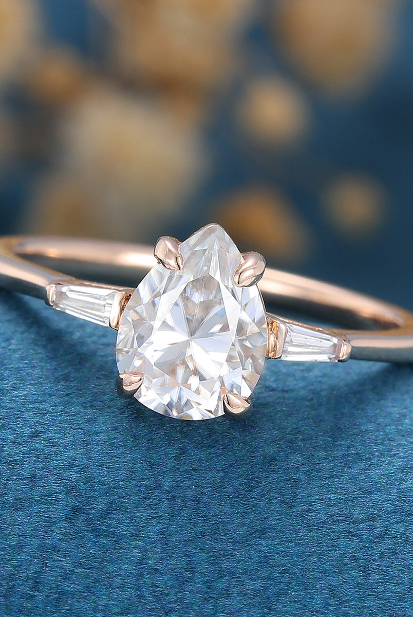 pear-shaped-moissanite-three-stones-engagement-ring