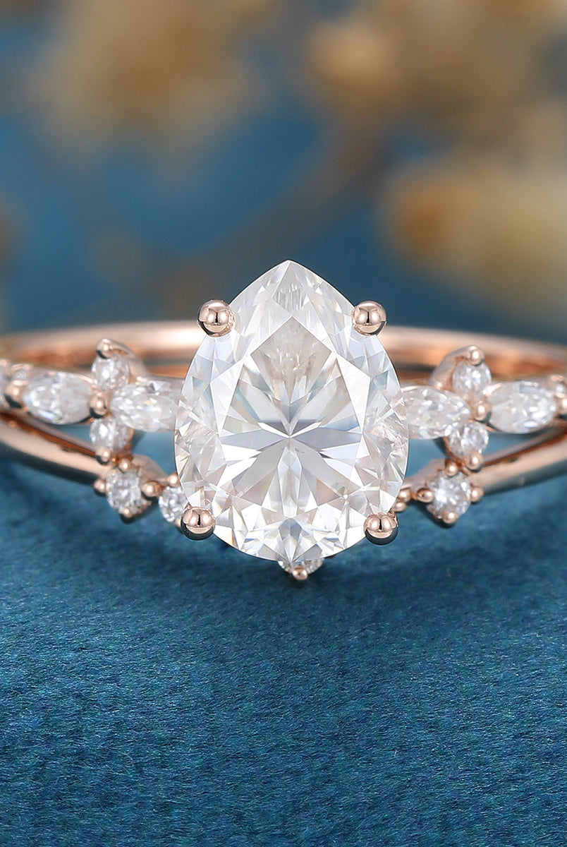 pear-shaped-moissanite-solitaire-pave-bridal-set