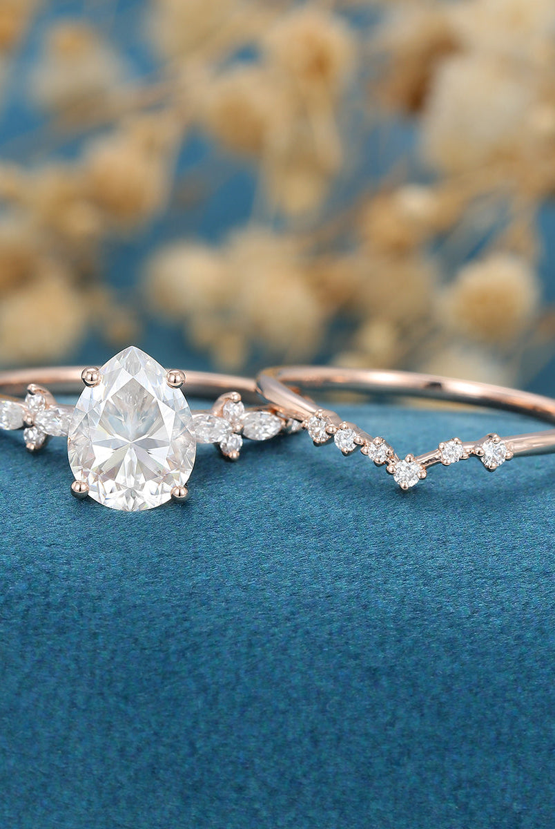 pear-shaped-moissanite-solitaire-pave-bridal-set