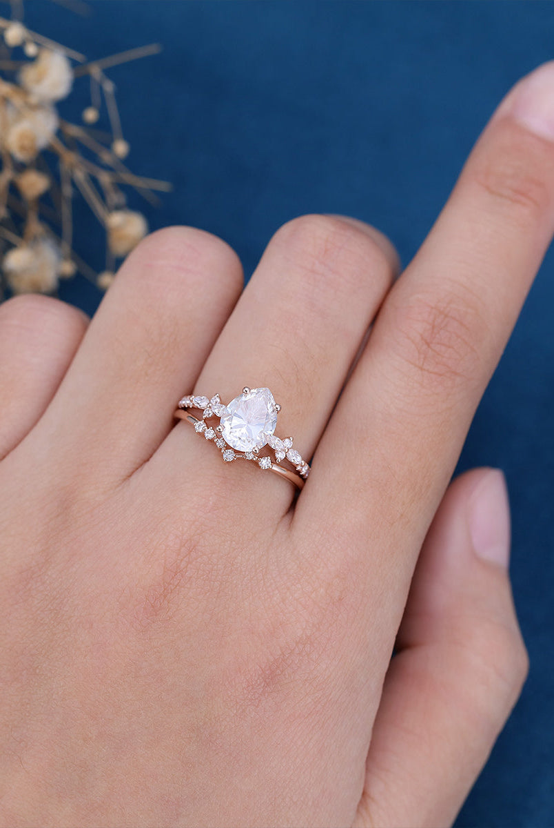 1-50-ct-pear-shaped-moissanite-solitaire-pave-bridal-set