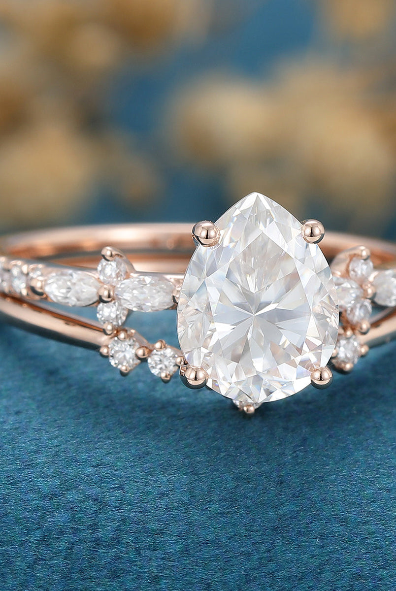 pear-shaped-moissanite-solitaire-pave-bridal-set