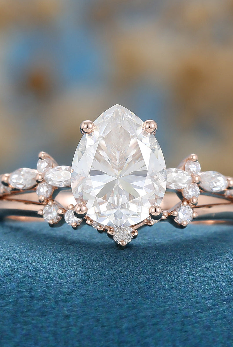 1-50-ct-pear-shaped-moissanite-solitaire-pave-bridal-set