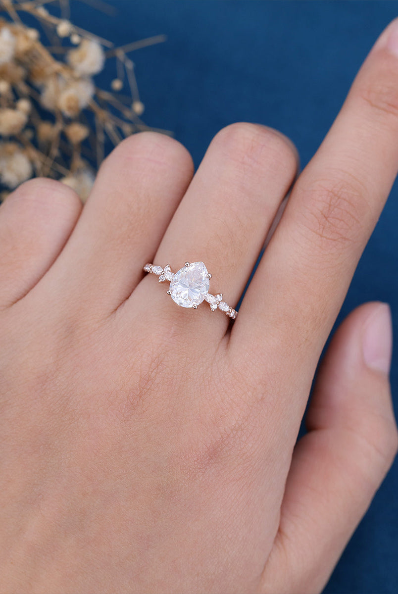 pear-shaped-moissanite-solitaire-pave-engagement-ring