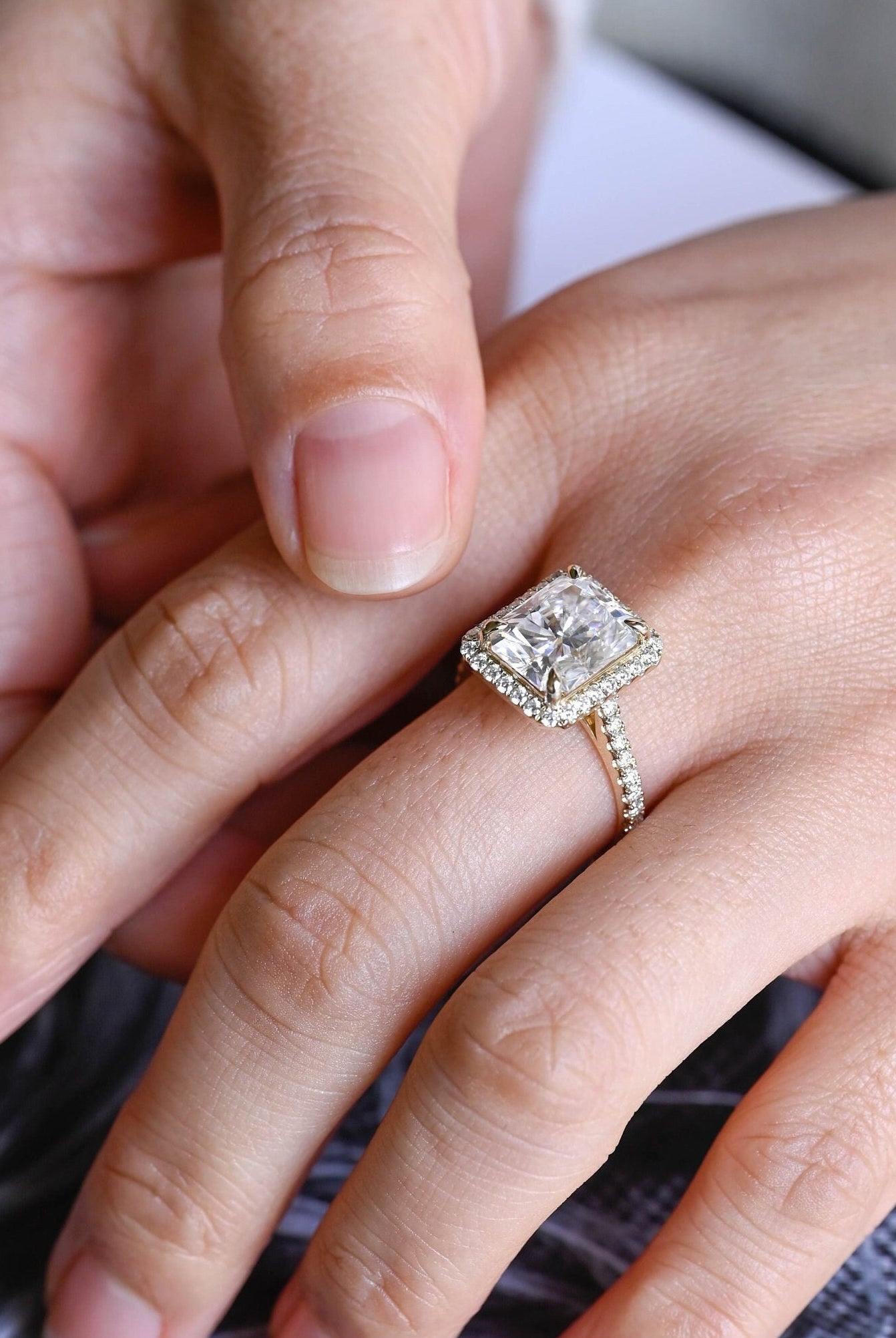 high sparkle radiant halo moissanite ring