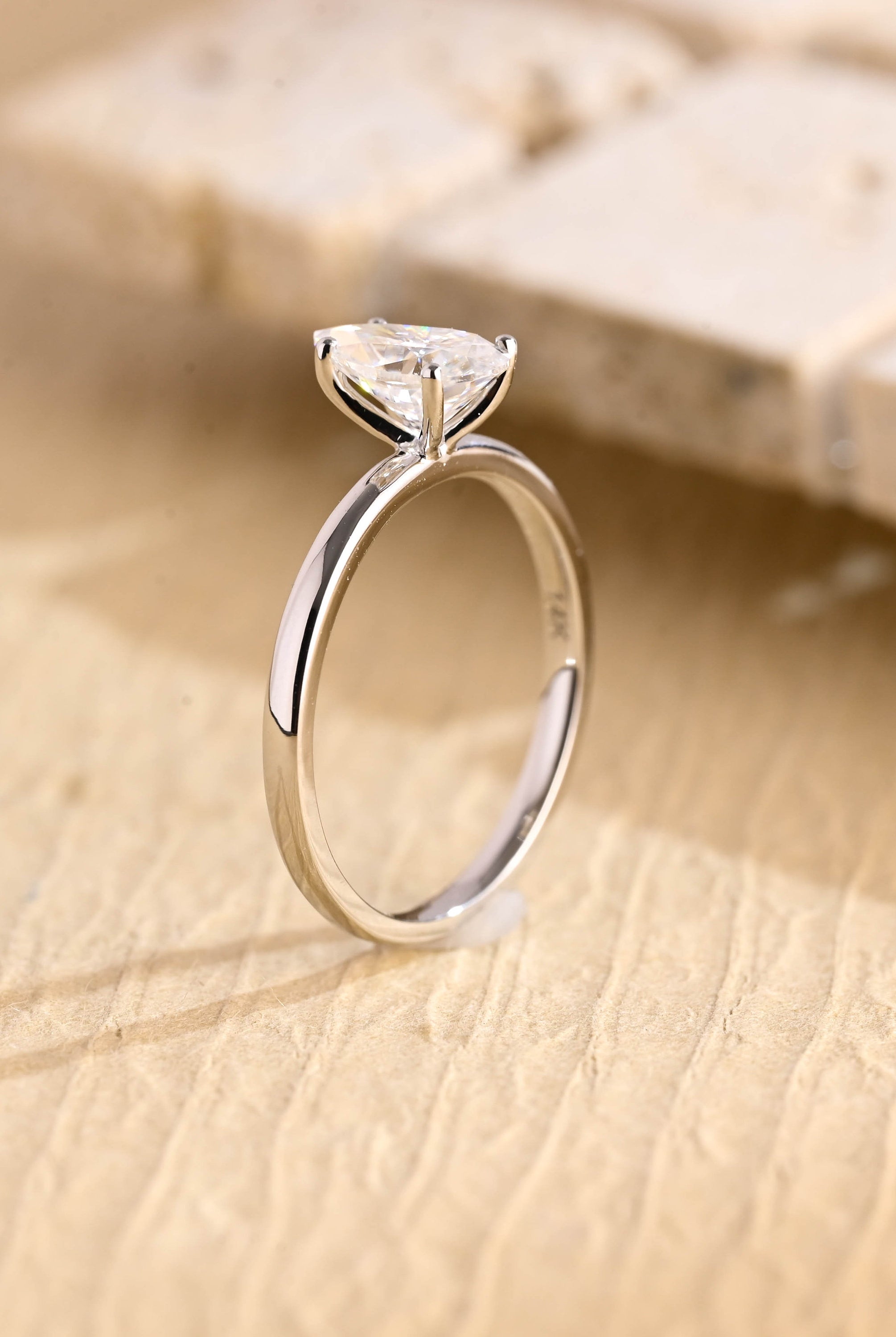 sparkling pear cut solitaire engagement ring moissanite