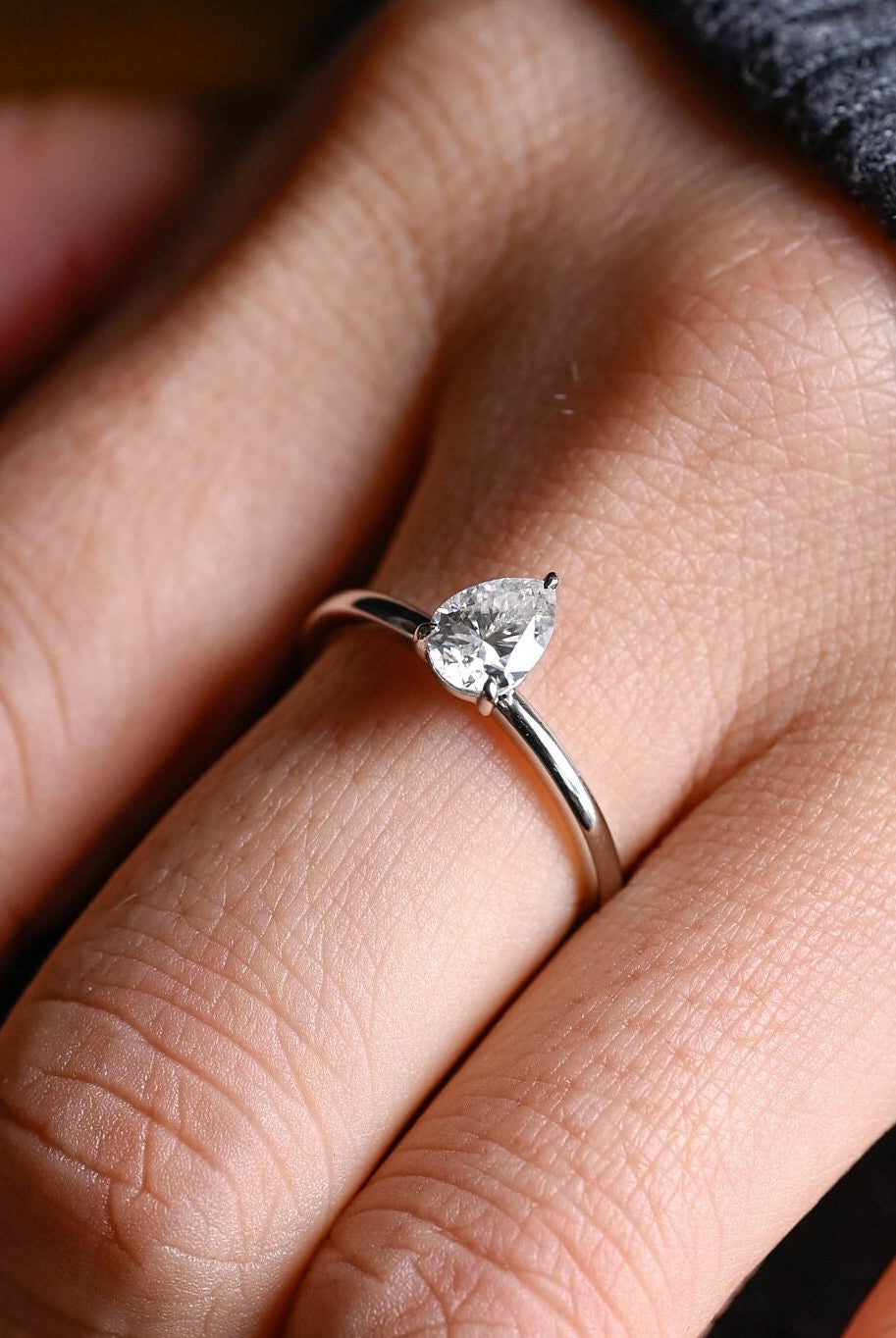 minimal pear cut solitaire engagement ring