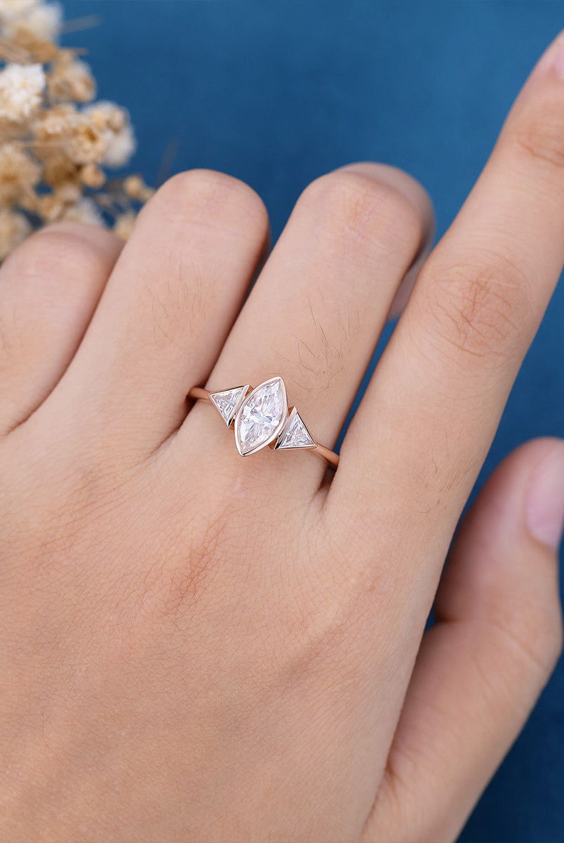 marquise-shaped-moissanite-bezel-3-stones-engagement-ring