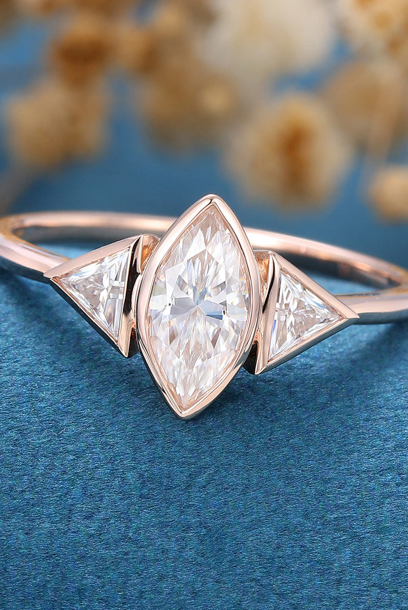 marquise-shaped-moissanite-bezel-3-stones-engagement-ring