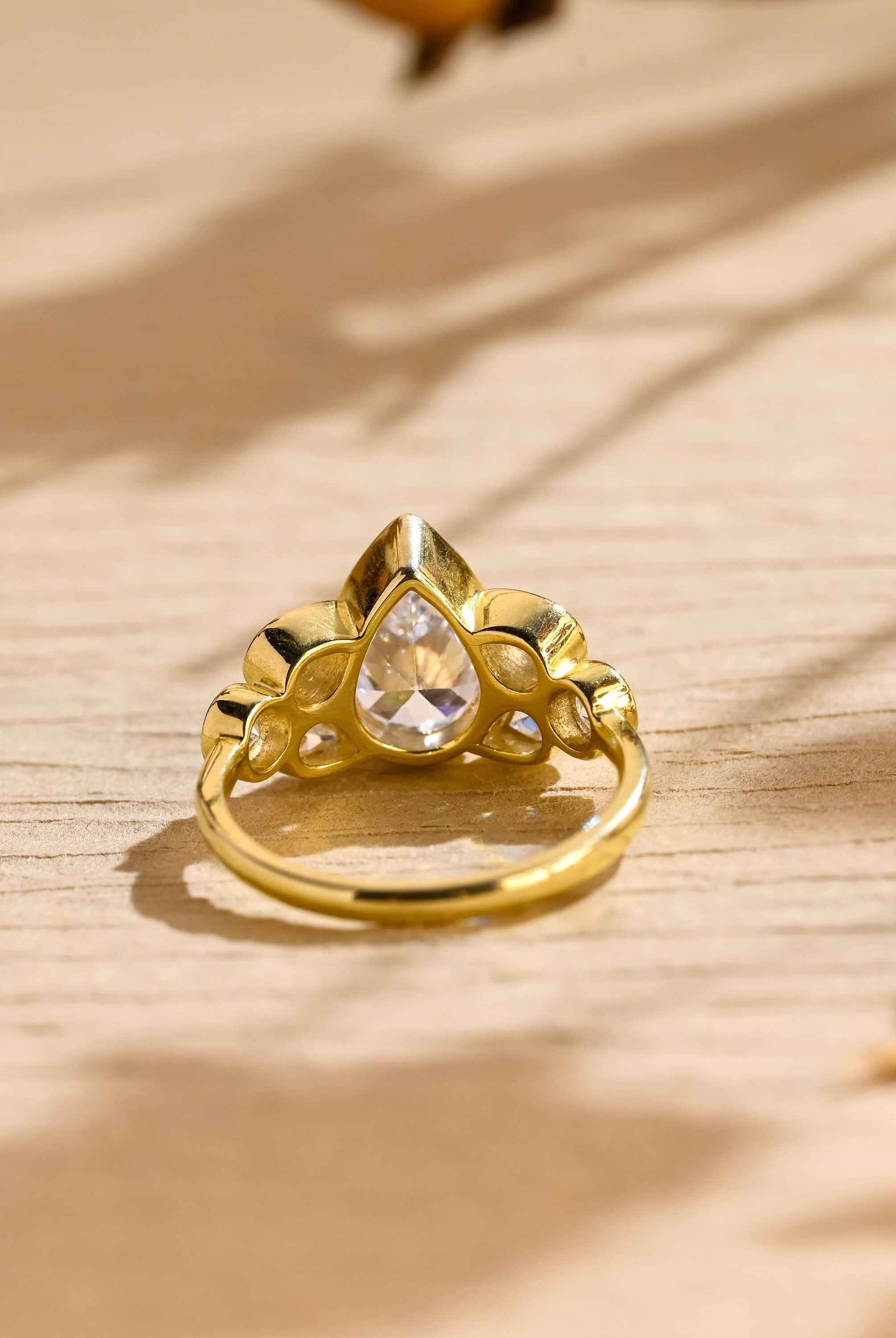 seven stone bezel pear shape moissanite engagement ring