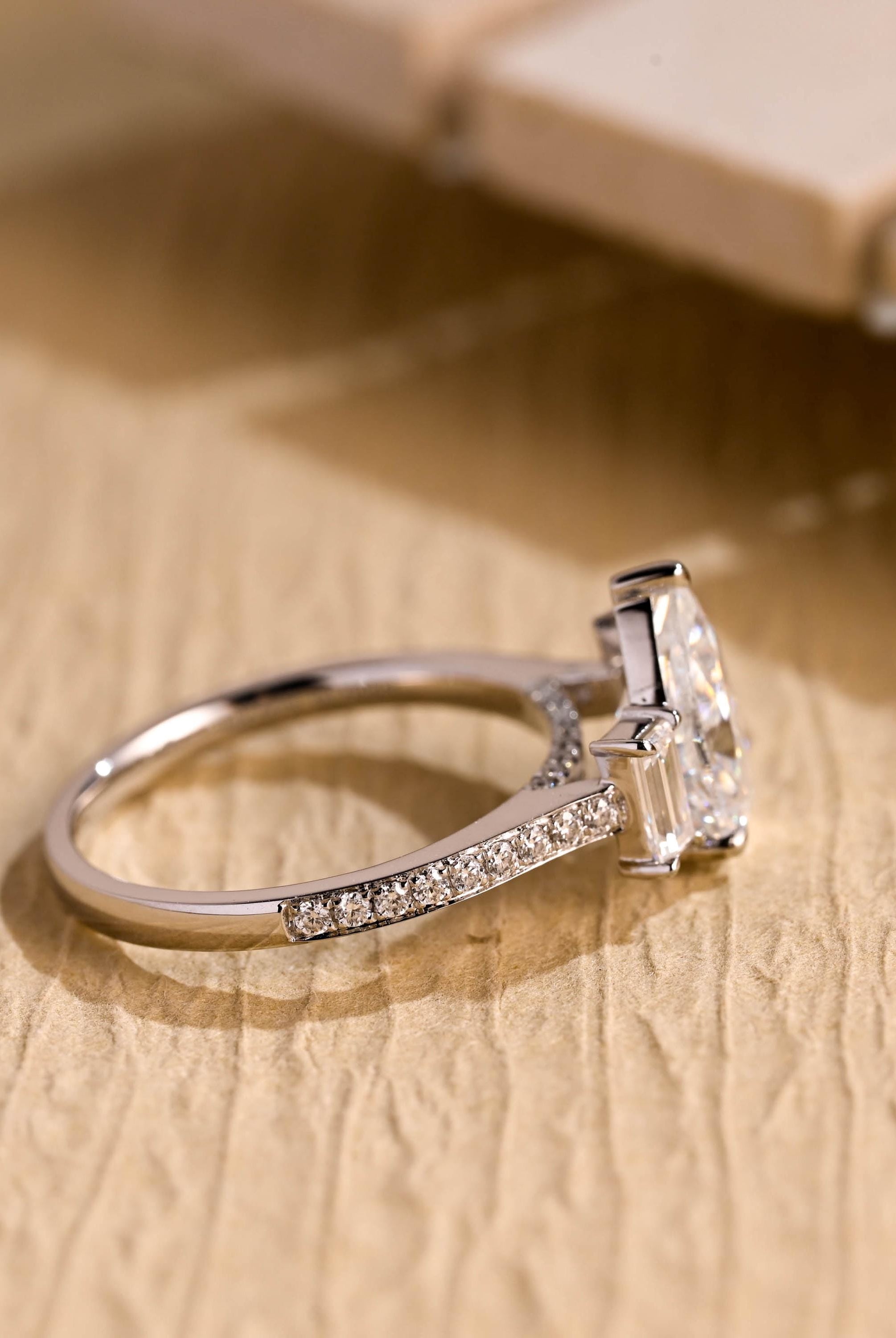pear cut moissanite engagement ring pavé band gold