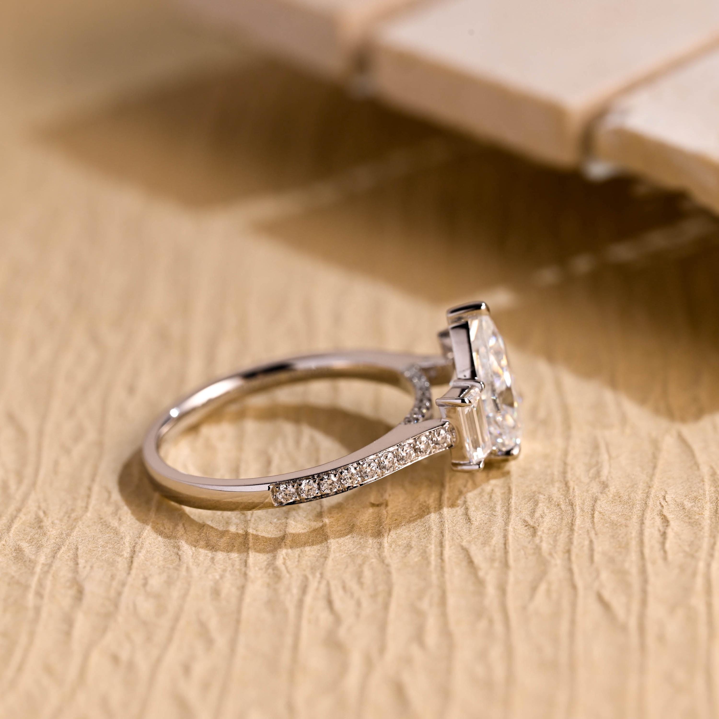 pear cut moissanite engagement ring pavé band gold