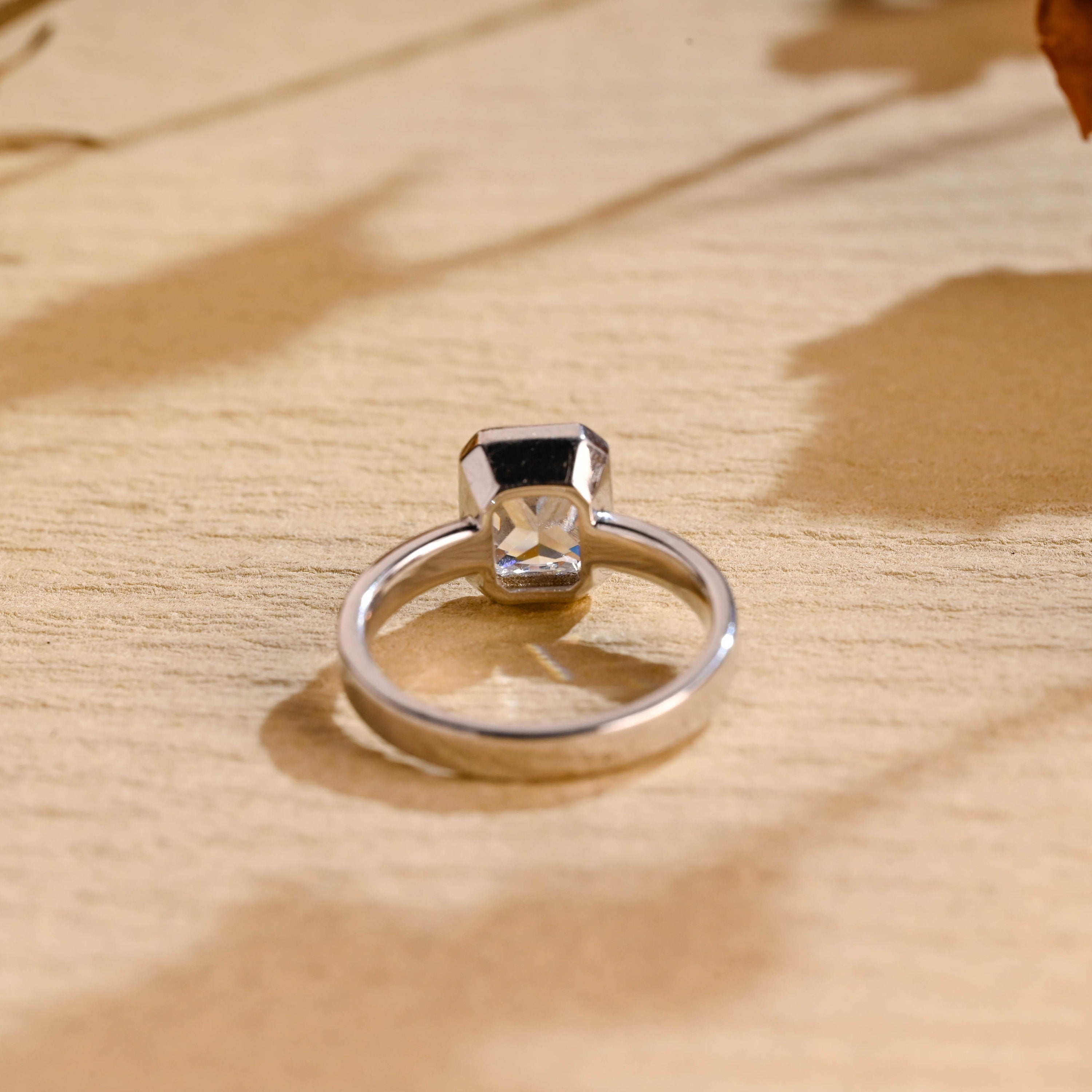 bezel set moissanite engagement ring radiant cut