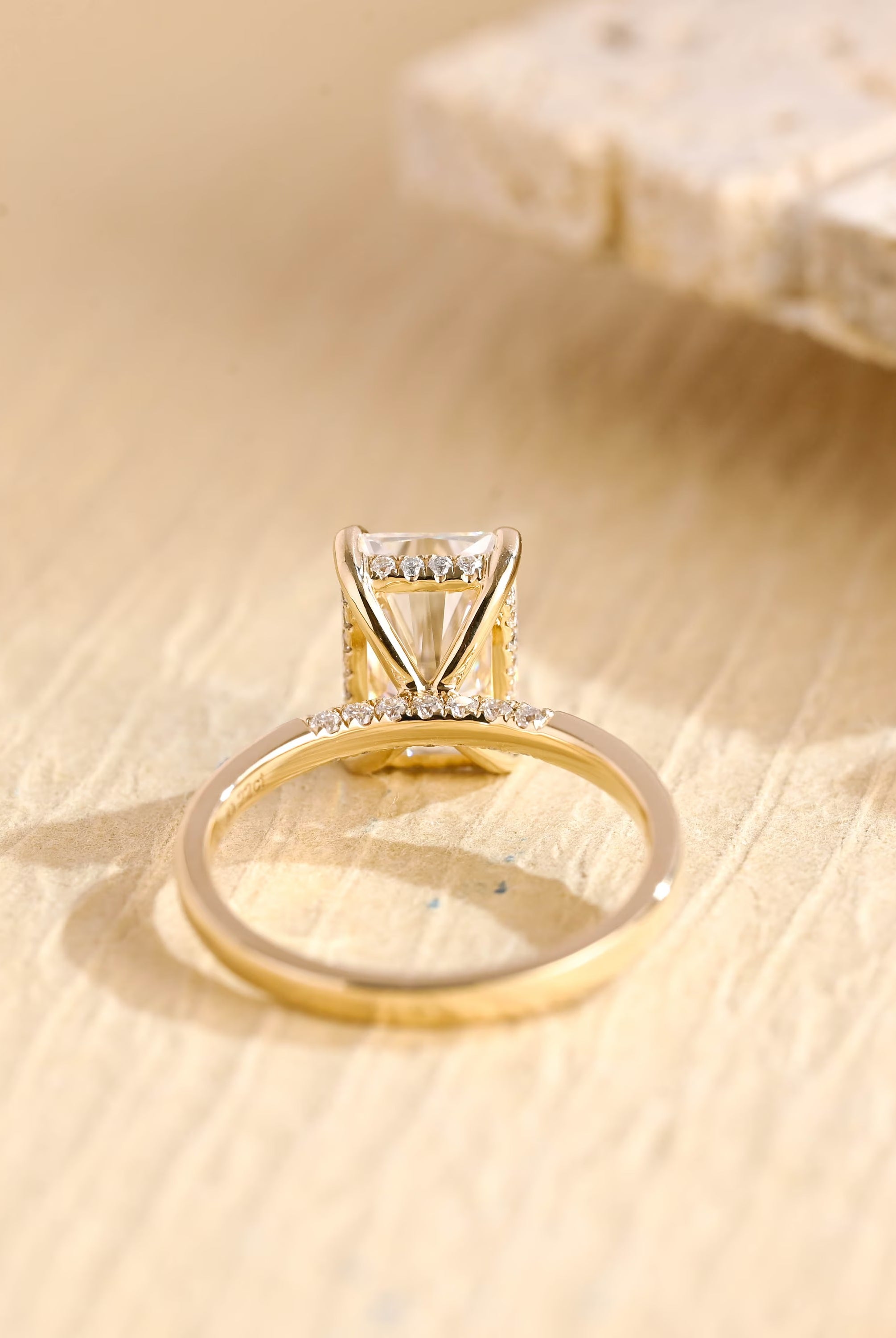 hidden halo moissanite engagement ring radiant cut gold
