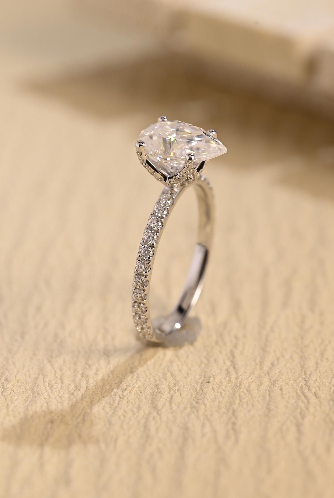 sparkling pavé pear cut moissanite engagement ring