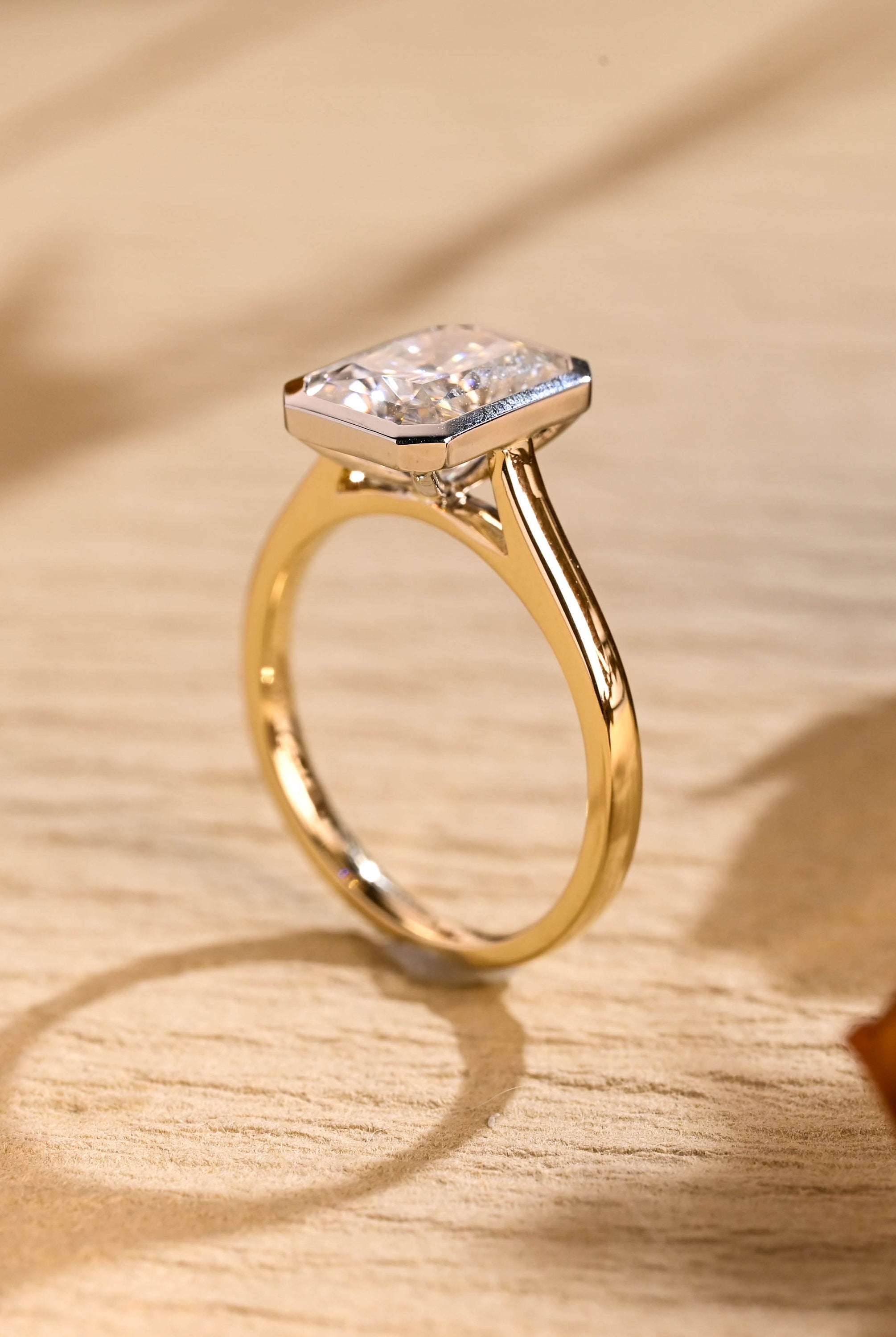 gold bezel moissanite engagement ring radiant cut