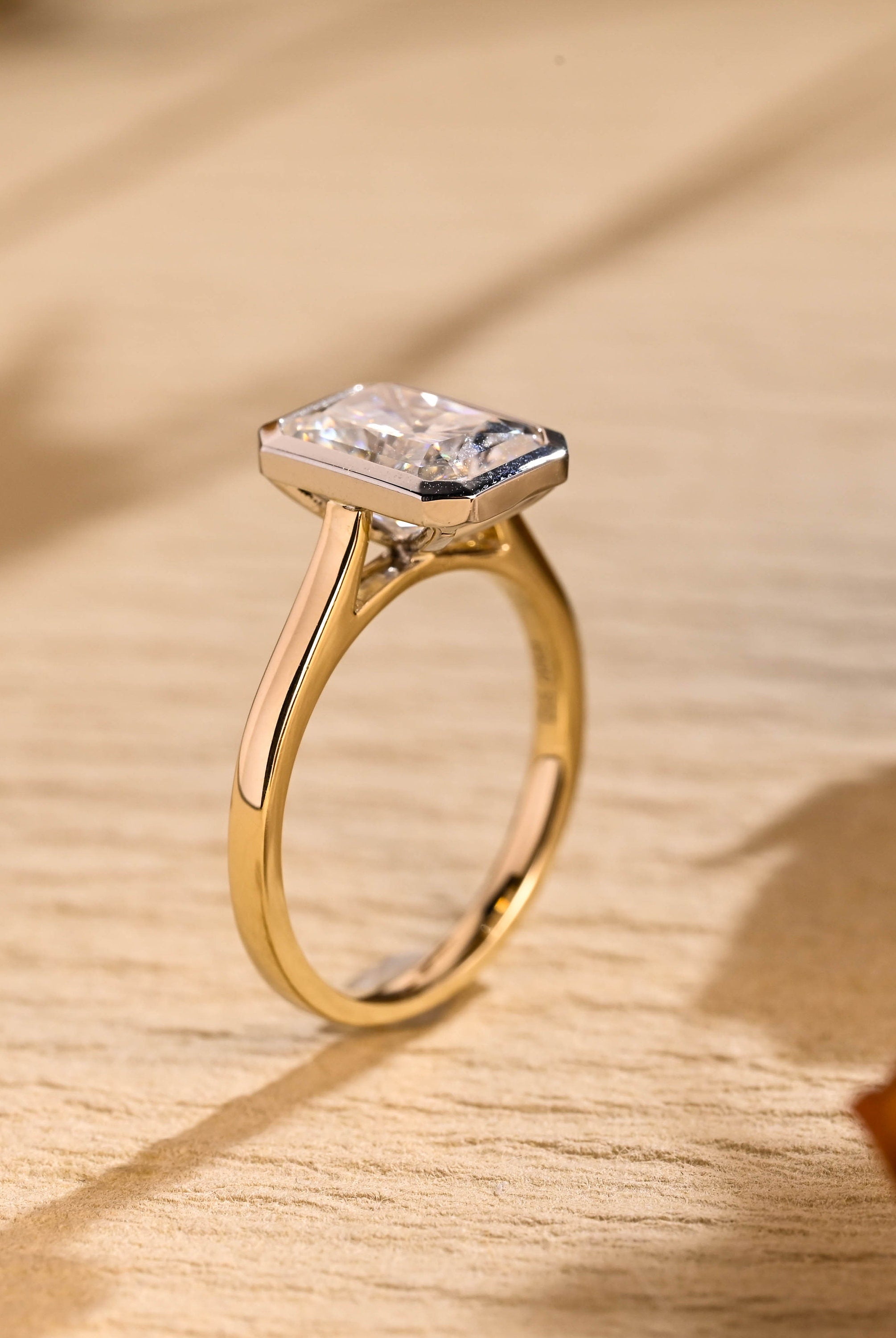 gold bezel moissanite engagement ring radiant cut