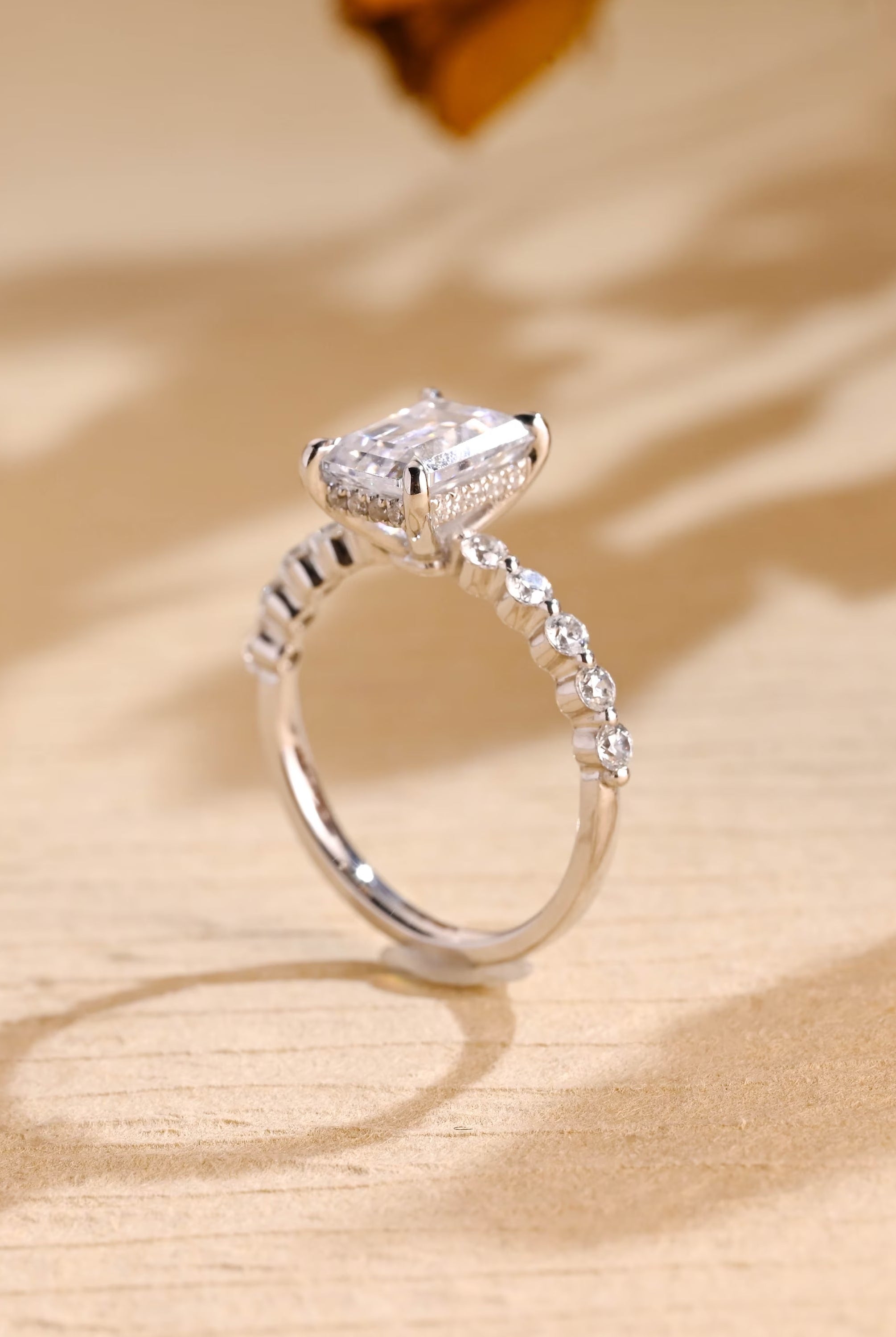 Sparkling Emerald Cut Moissanite Ring with Hidden Halo Setting