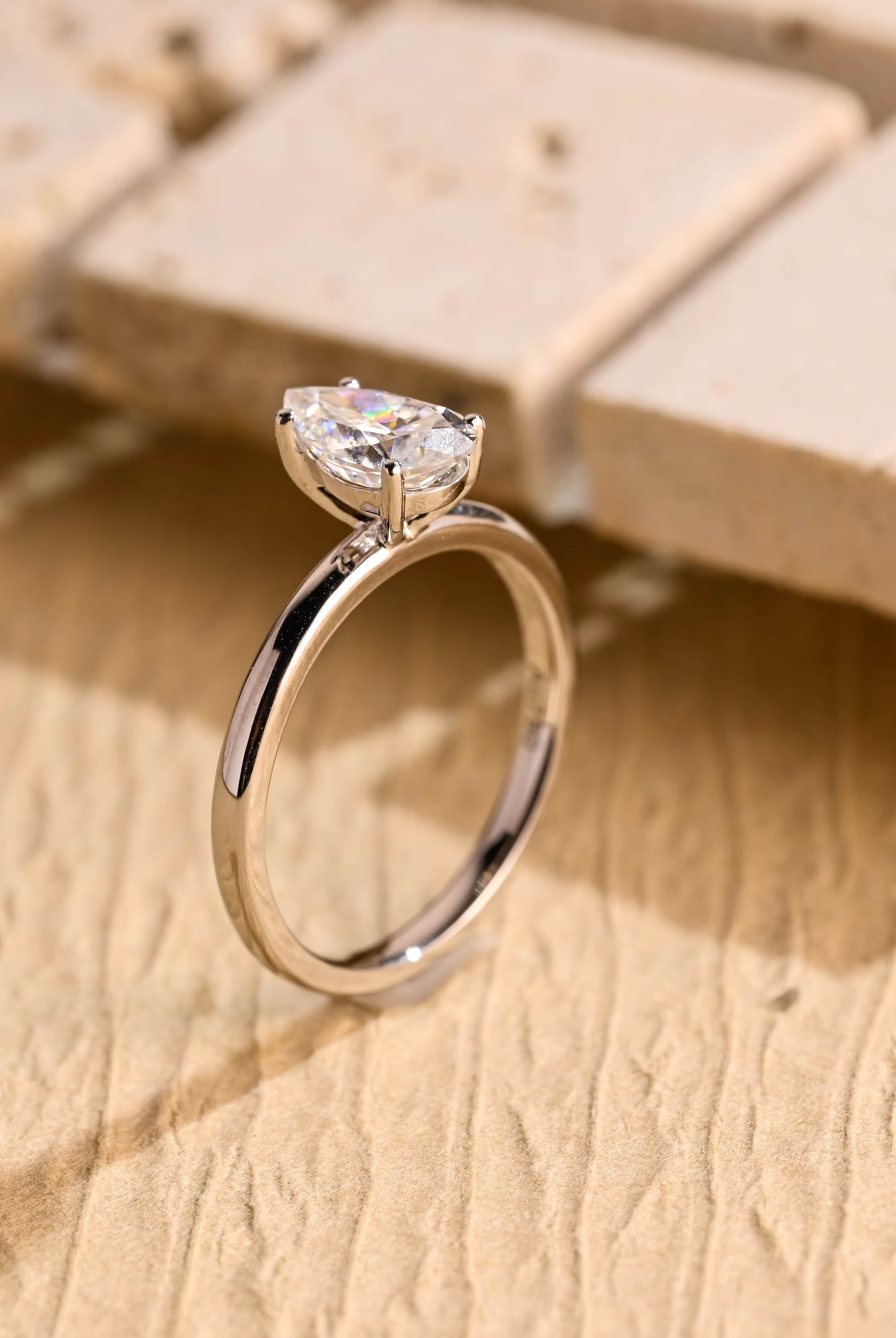 minimalist pear solitaire engagement ring moissanite