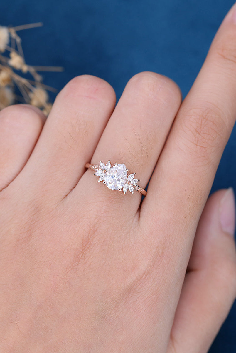 pear-shape-moissanite-cluster-engagement-ring