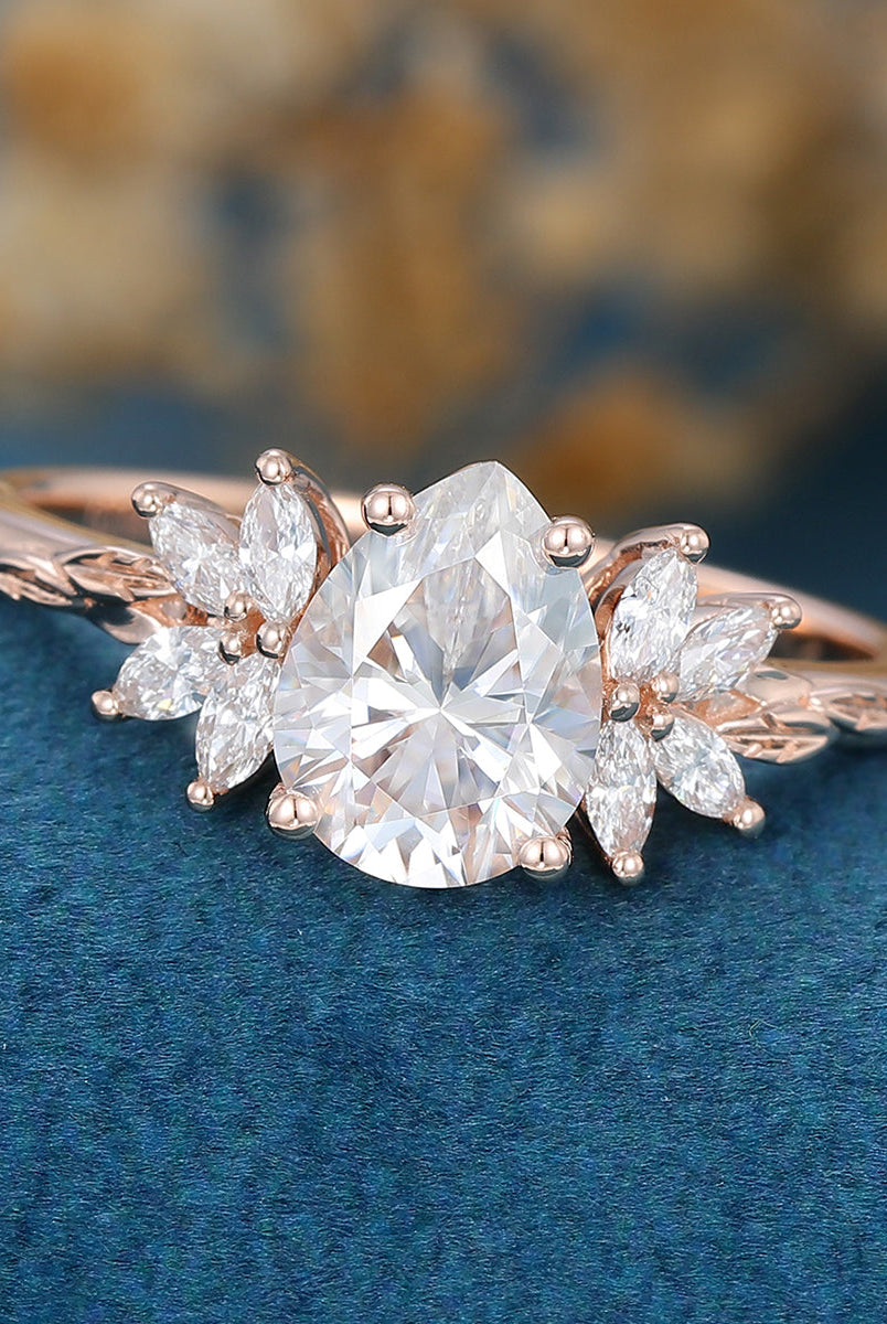 pear-shape-moissanite-cluster-engagement-ring