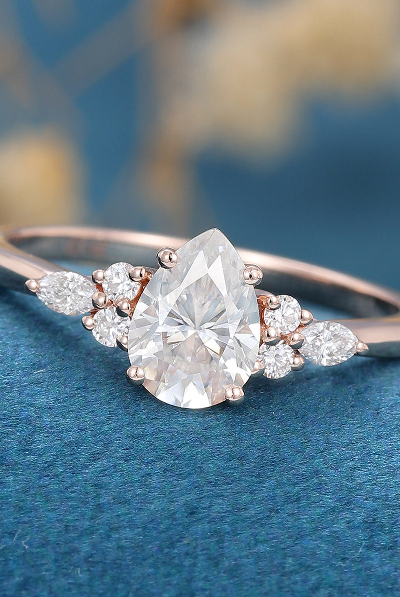 1-0-ct-pear-shaped-moissanite-cluster-engagement-ring-19