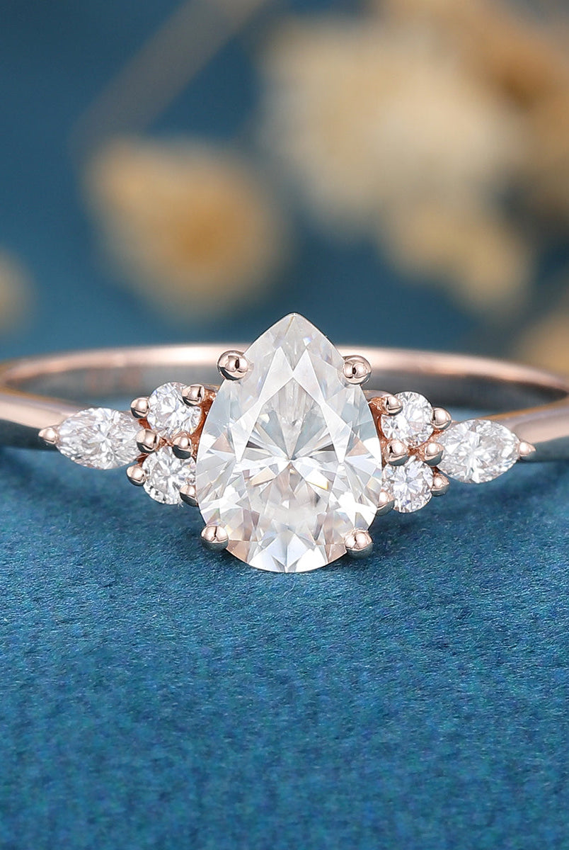 1-0-ct-pear-shaped-moissanite-cluster-engagement-ring-17