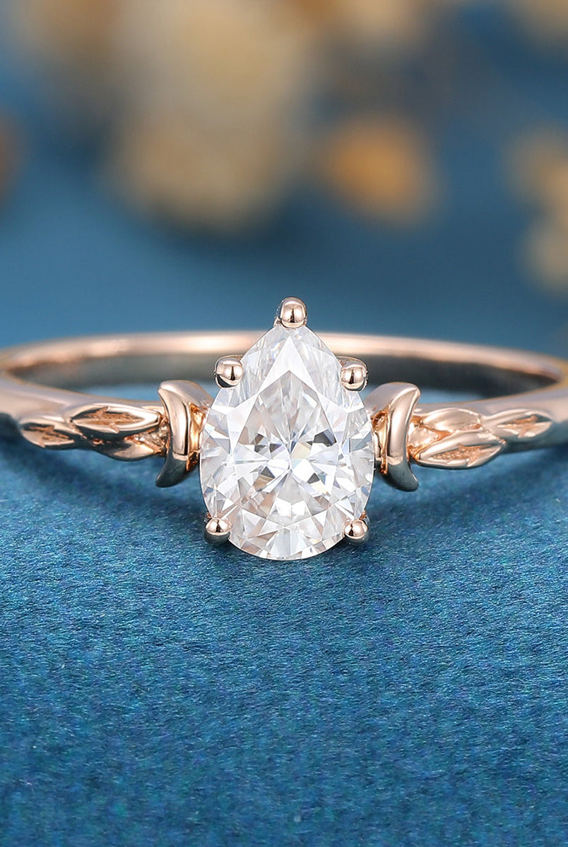 0-69-ct-pear-shaped-moissanite-vintage-solitaire-engagement-ring-1