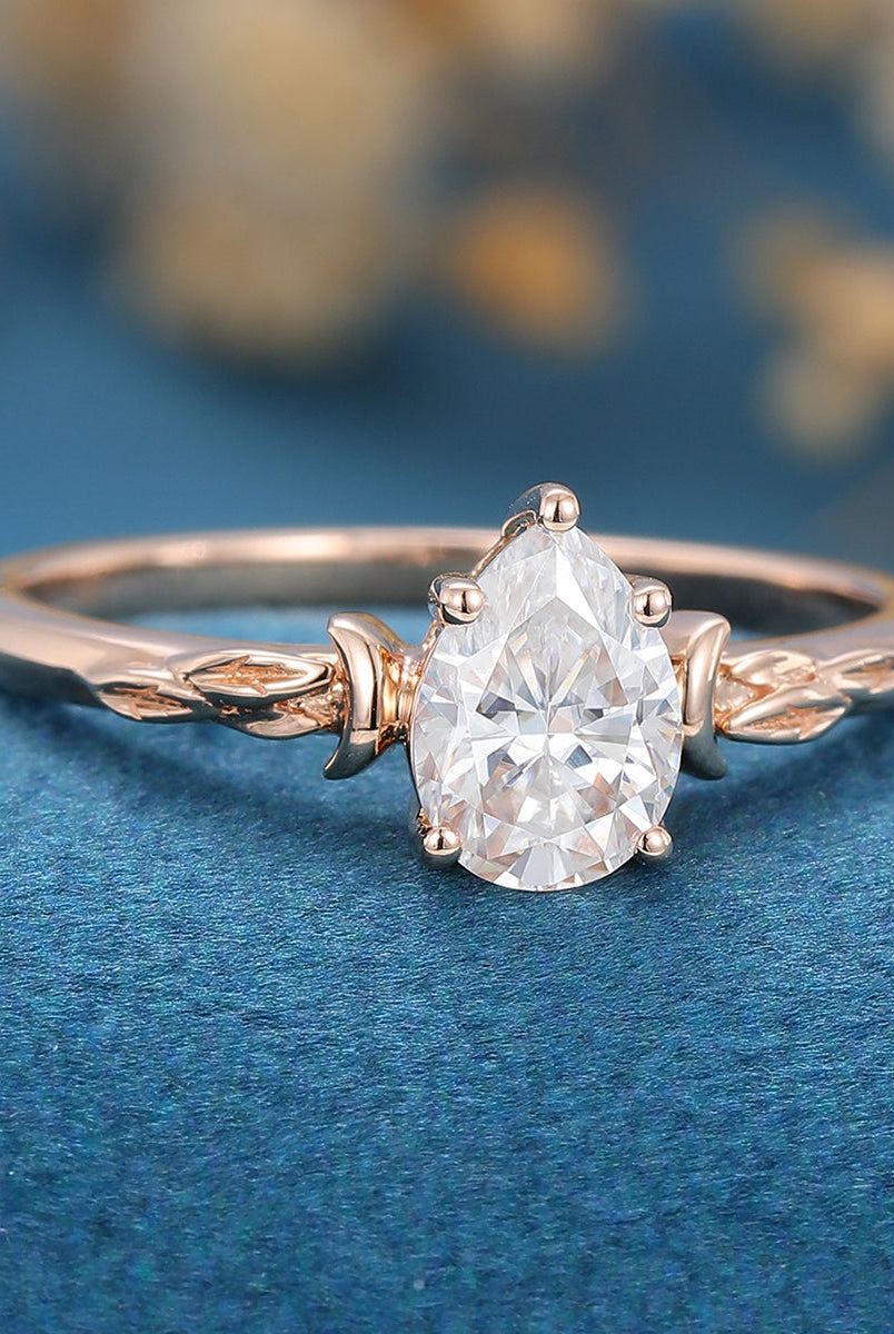 0-69-ct-pear-shaped-moissanite-vintage-solitaire-engagement-ring-3