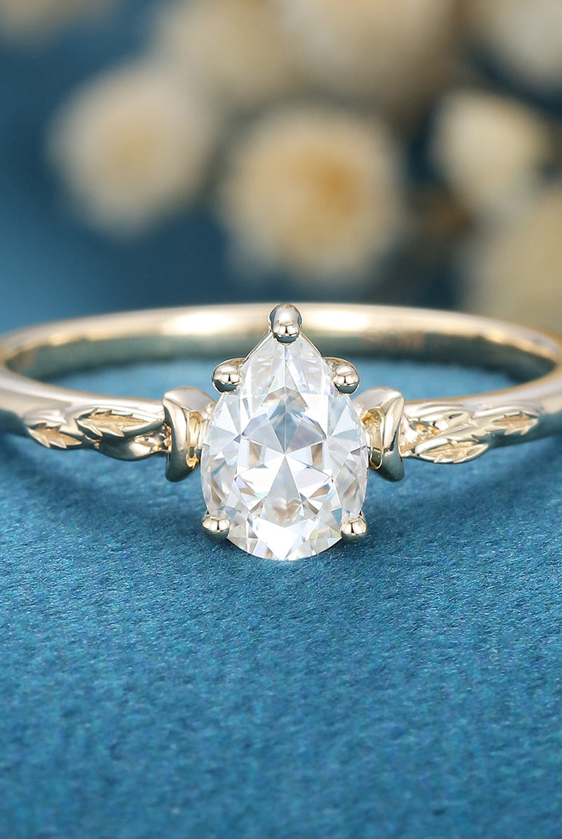 0-69-ct-pear-shaped-moissanite-vintage-solitaire-engagement-ring