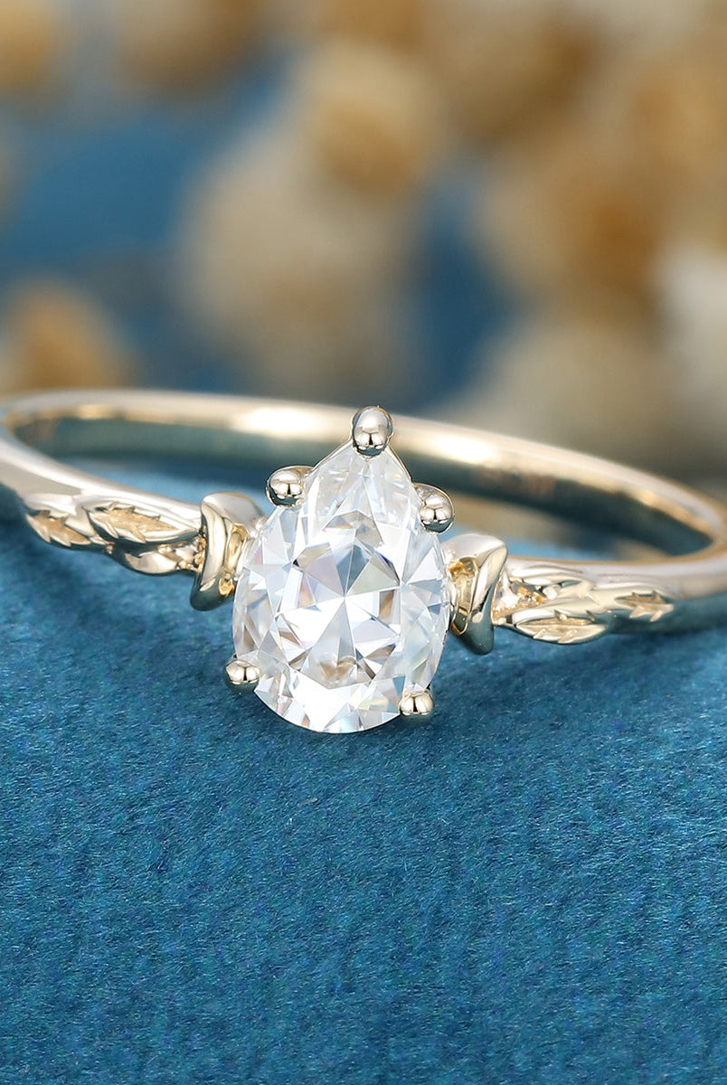 0-69-ct-pear-shaped-moissanite-vintage-solitaire-engagement-ring