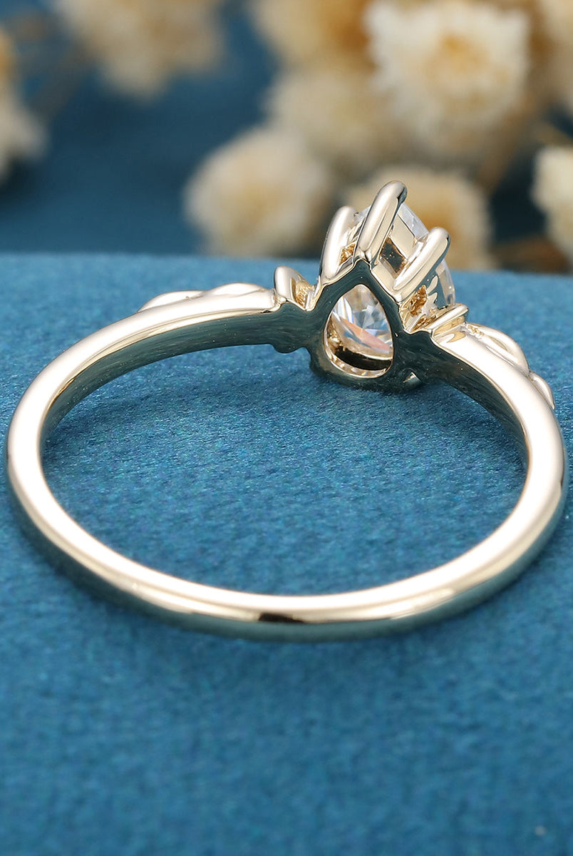 0-69-ct-pear-shaped-moissanite-vintage-solitaire-engagement-ring