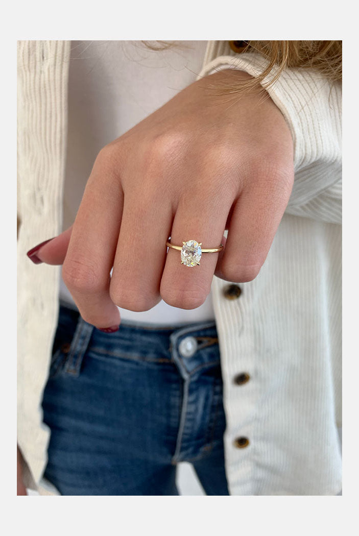 1.50ct Oval Four Prong Moissanite Diamond Solitaire Engagement Ring In 18K Yellow Gold