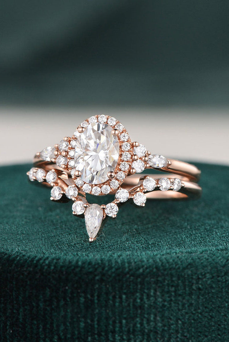 oval-cut-cluster-halo-moissanite-bridal-ring-set