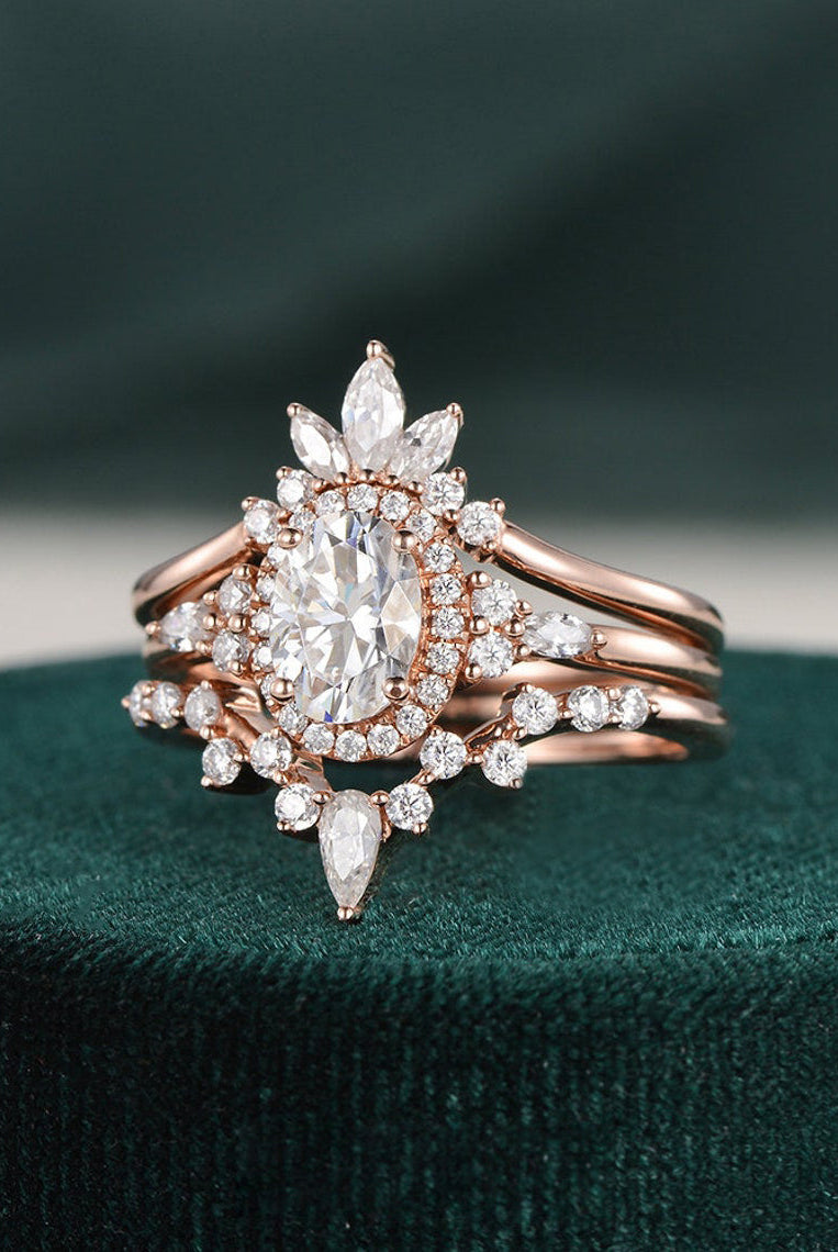 oval-cut-cluster-halo-moissanite-bridal-ring-set