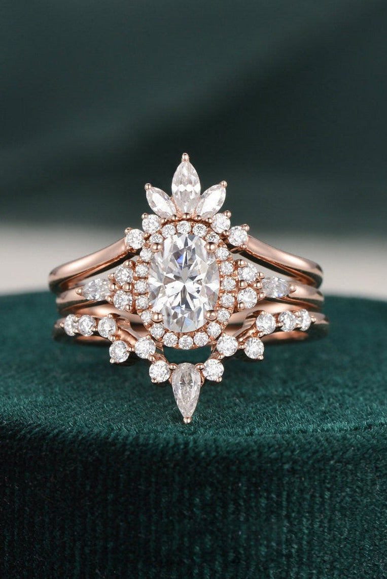 oval-cut-cluster-halo-moissanite-bridal-ring-set