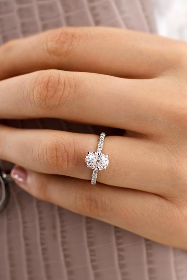 oval-shaped-moissanite-solitaire-with-pave-setting-engagement-ring