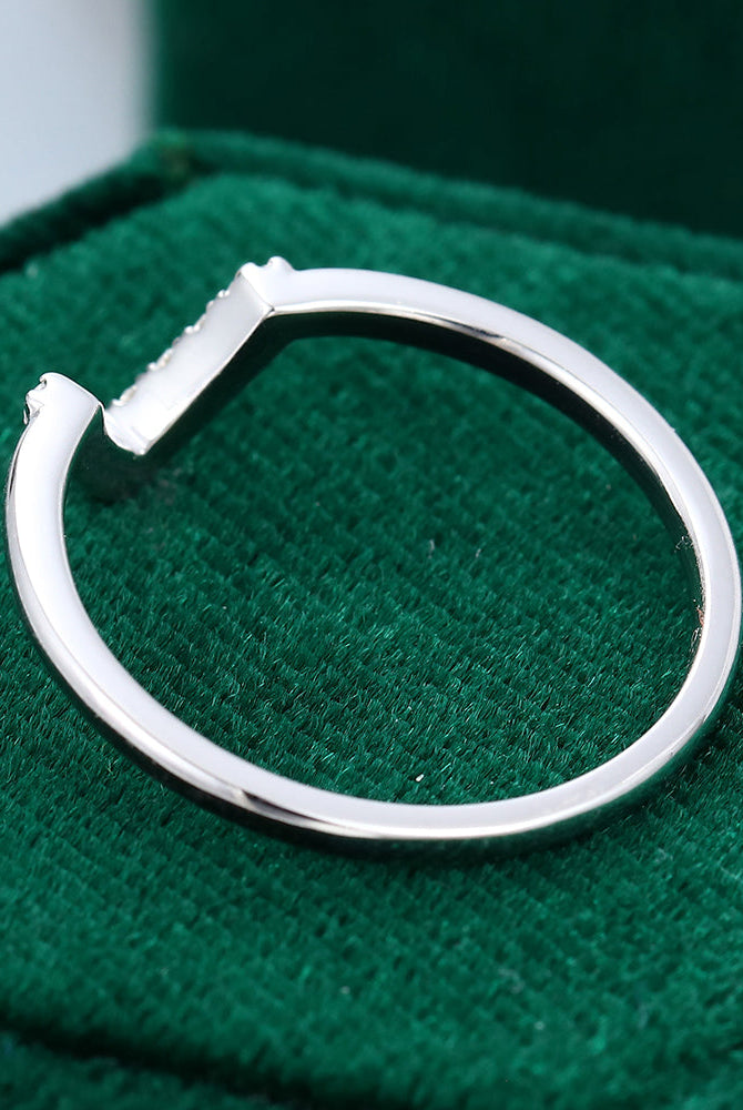 round-moissanite-v-shaped-wedding-band