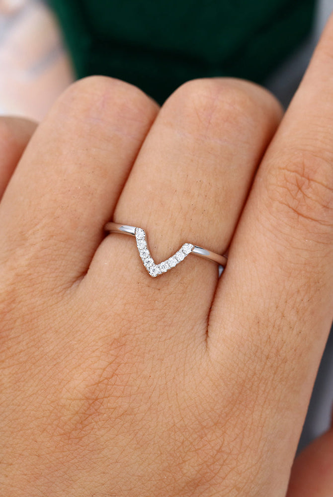 round-moissanite-v-shaped-wedding-band