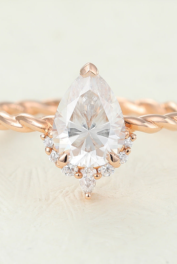 0-90-ct-pear-shaped-moissanite-cluster-engagement-ring