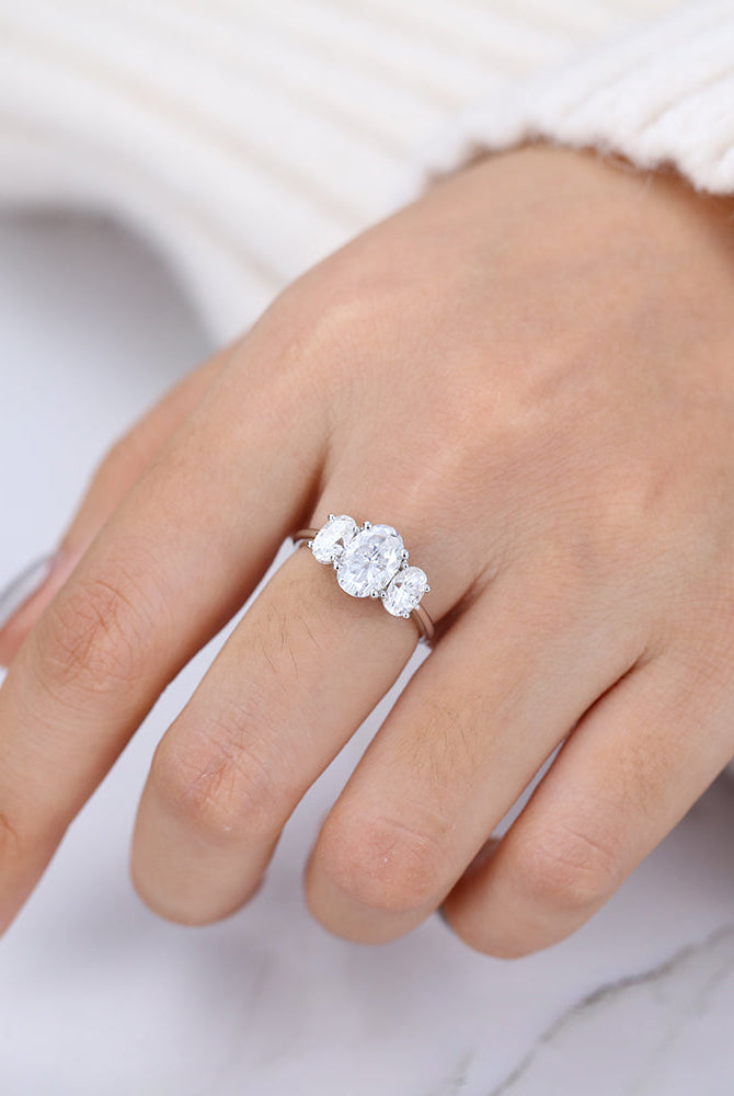 oval-shaped-moissanite-three-stone-engagement-ring