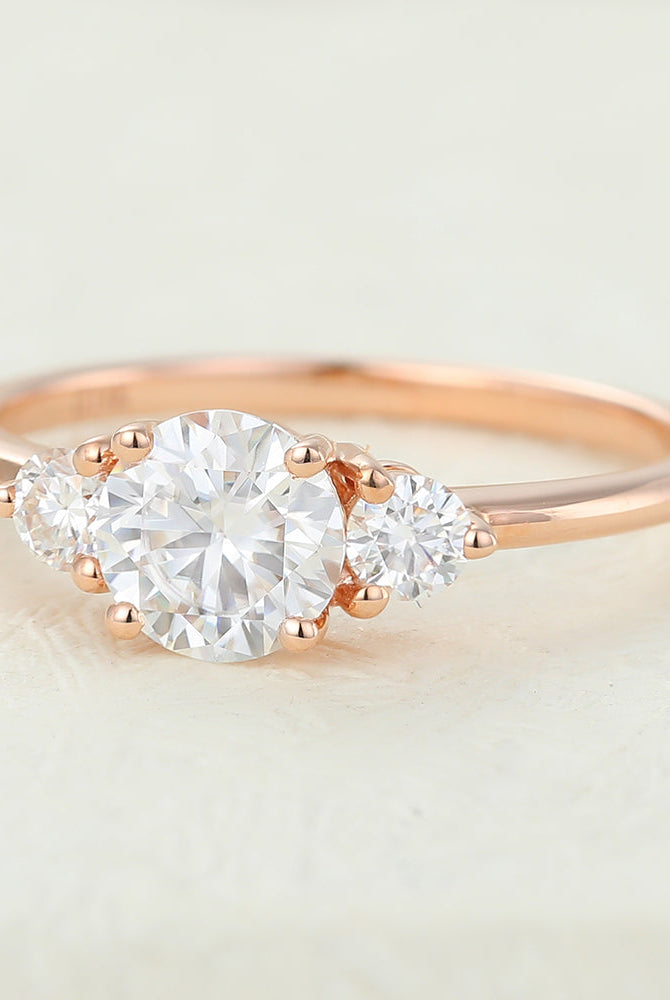 0-68-ct-round-shaped-moissanite-three-stone-engagement-ring