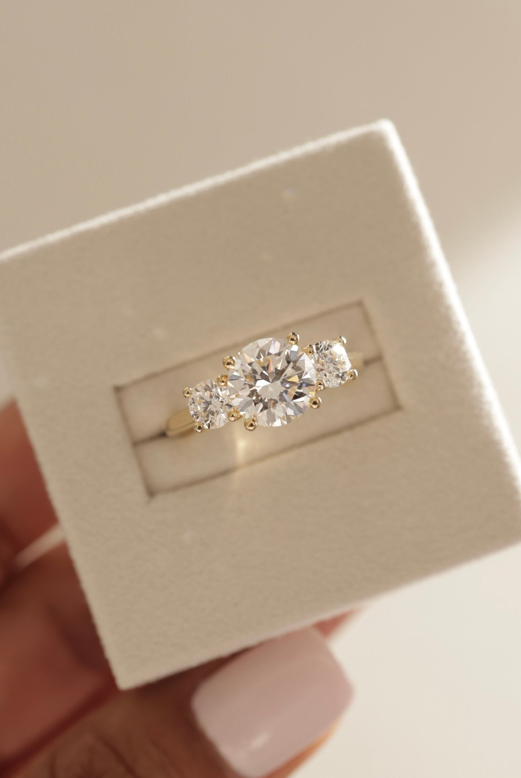 round moissanite trilogy ring, modern three stone ring, brilliant moissanite engagement band, luxury moissanite ring, sentimental three stone ring design