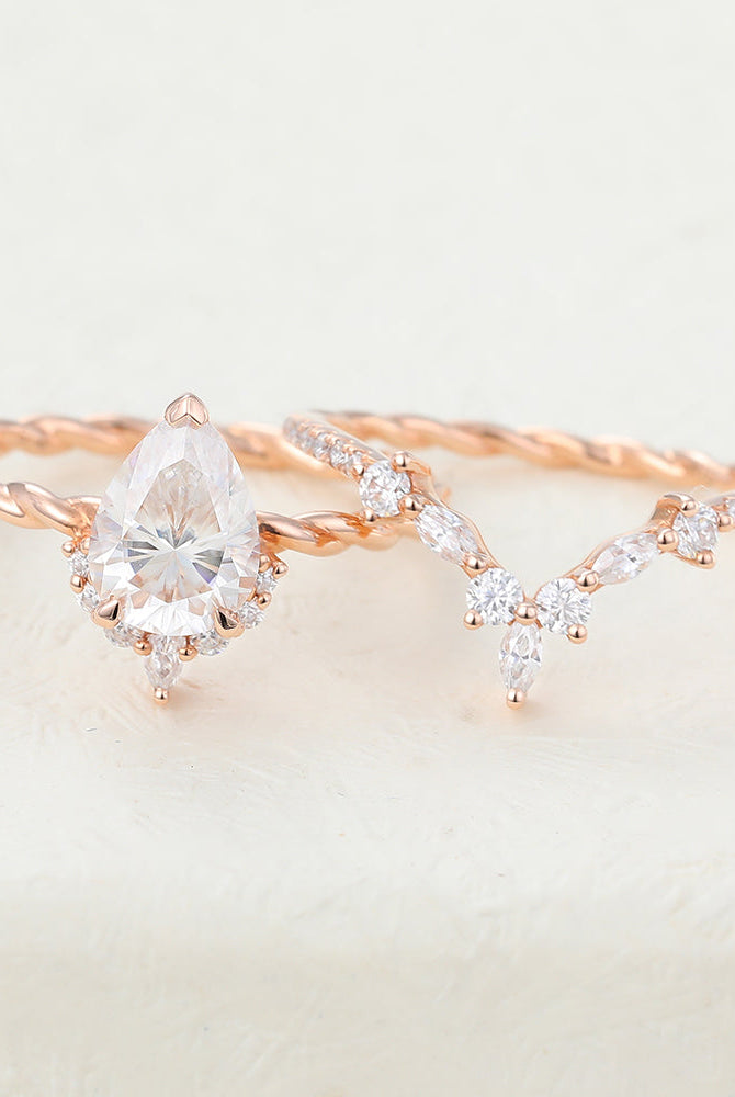 1-0-ct-pear-moissanite-cluster-bridal-ring-set-6