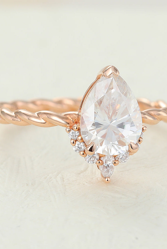 0-90-ct-pear-shaped-moissanite-cluster-engagement-ring