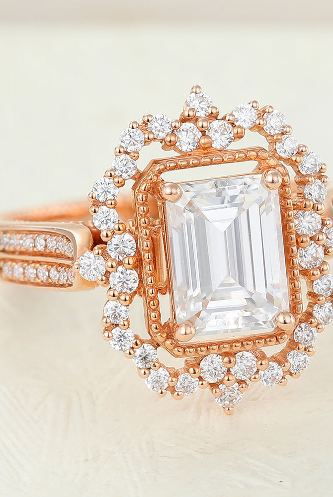 emerald-shaped-moissanite-cluster-halo-engagement-ring